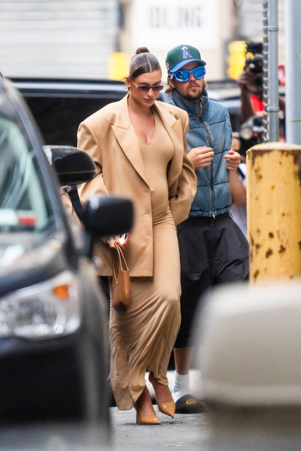 Hailey Bieber Shows Baby Bump in Nude Bodycon Dress in NYC