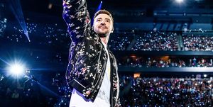 justin timberlake on stage with crowd behind him