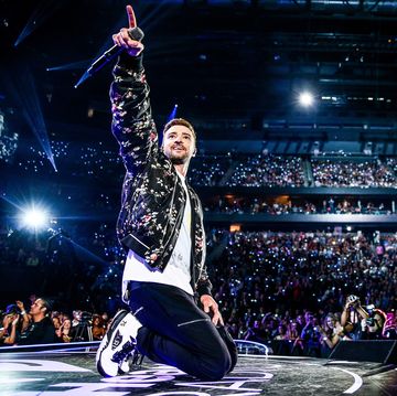 justin timberlake on stage with crowd behind him