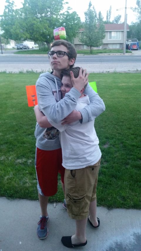 justin hugging brother