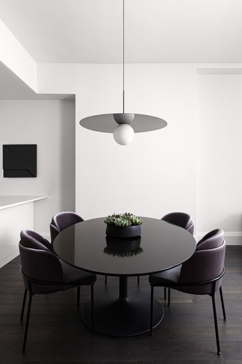 dining room, black dining table with dark purple leather chairs