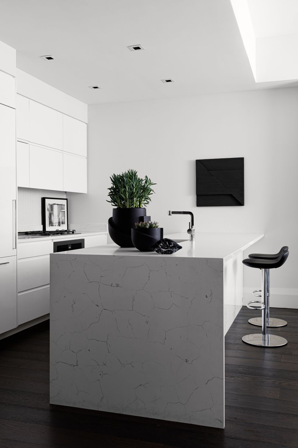 kitchen, white marble countertop white cabinets, black bar stools
