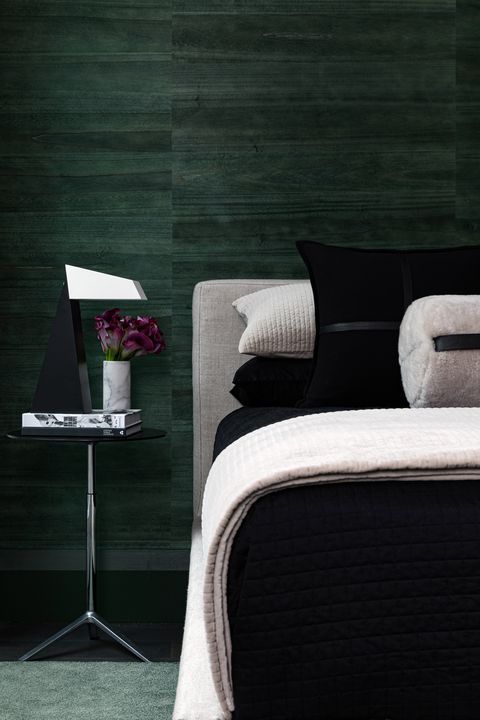 bedroom, black bed sheets, green wall covering