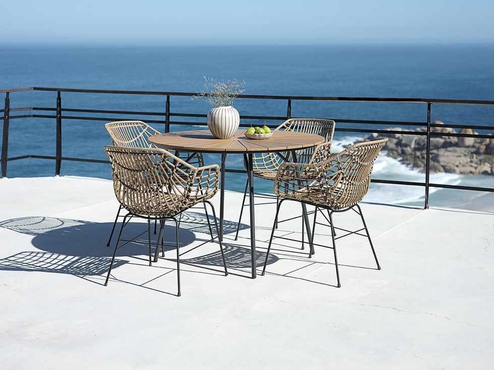 a table and chairs on a deck