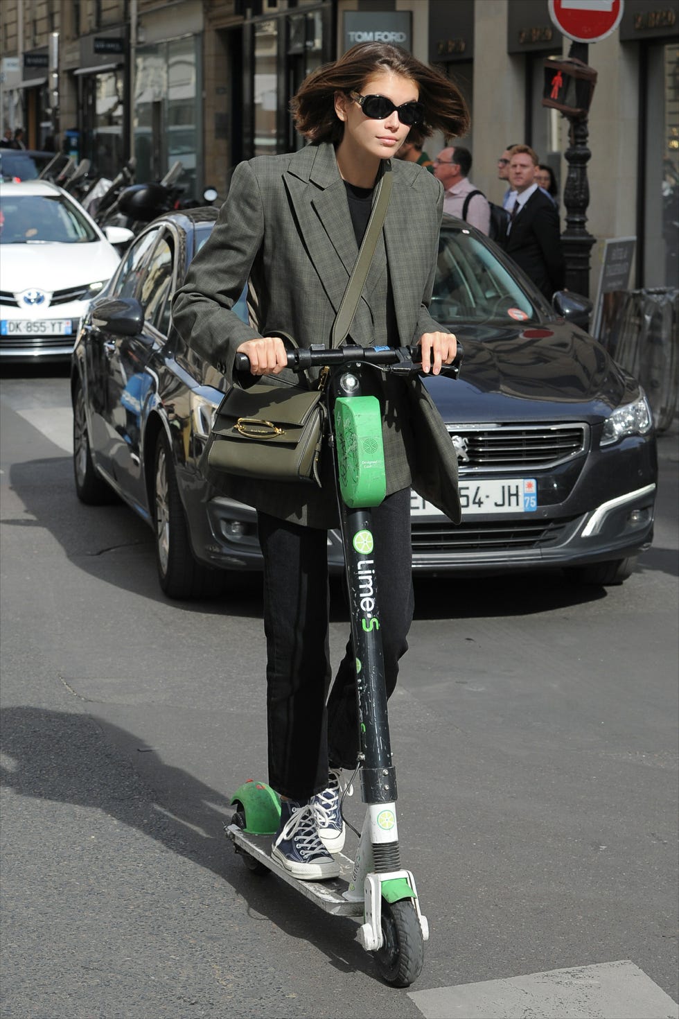 Kaia Gerber Riding a Scooter During Paris Fashion Week