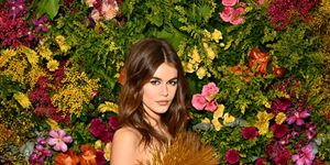kaia gerber wearing a gold tassel dress at the british vogue and tiffany co celebrate fashion and film party