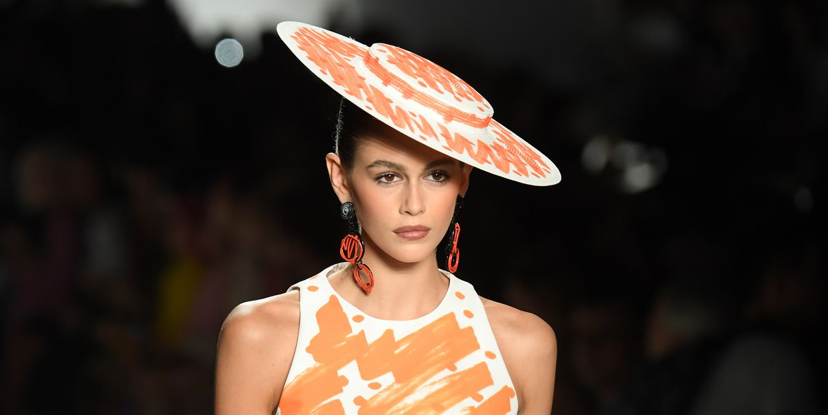 https://hips.hearstapps.com/hmg-prod/images/kaia-gerber-hat-detail-walks-the-runway-at-the-moschino-news-photo-1036701412-1550771219.jpg?crop=1.00xw:0.752xh;0,0.0160xh&resize=1200:*