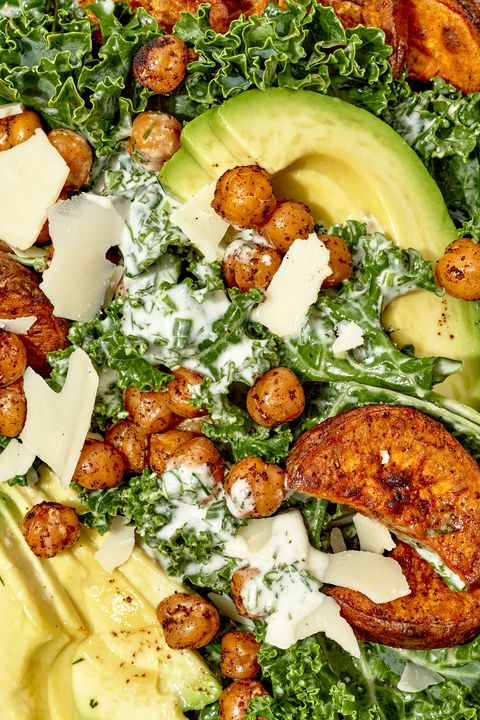 closeup of coconut ranch kale salad with chickpeas, sweet potatoes, and avocado