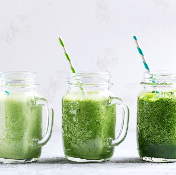 variety of three color green spinach kale apple yogurt smoothie in mason jars in row with retro cocktail tubes over gray background healthy vegan detox eating photo by natasha breenredacouniversal images group via getty images
