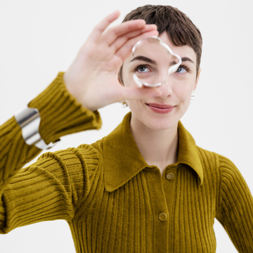 a person holding a pair of rings