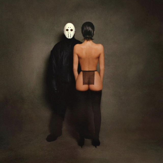 two people wearing masks