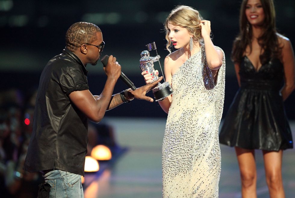 Kanye West jumps onstage after Taylor Swift won the Best Female Video award during the 2009 MTV Video Music Awards on September 13, 2009, in New York City.