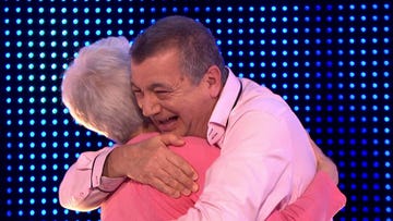 karen, ian hug after winning on the chase