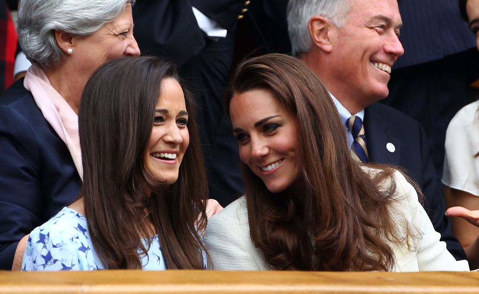 kate middleton and pippa middleton laughing at a tennis match together