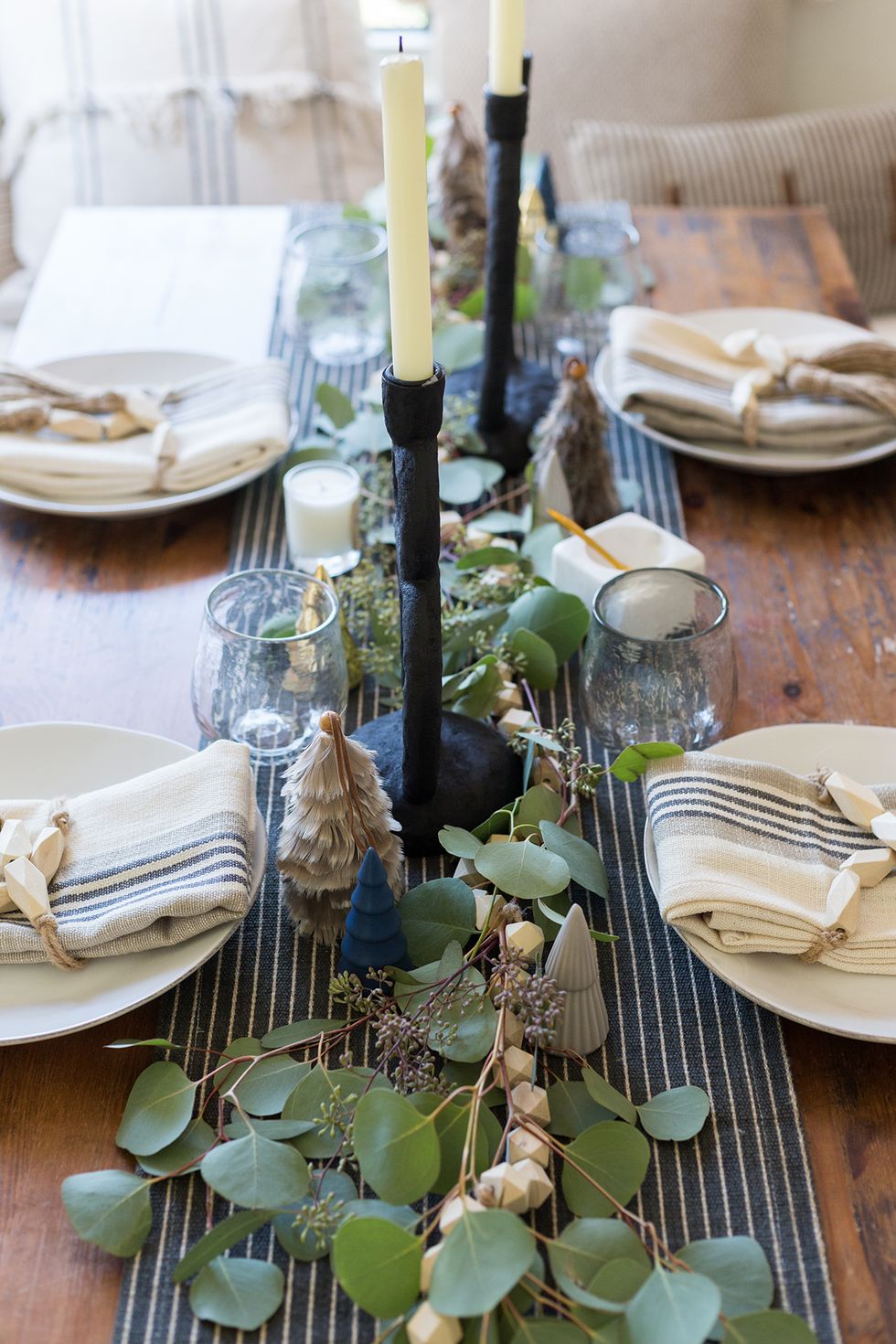 table runner with mini trees and greenery