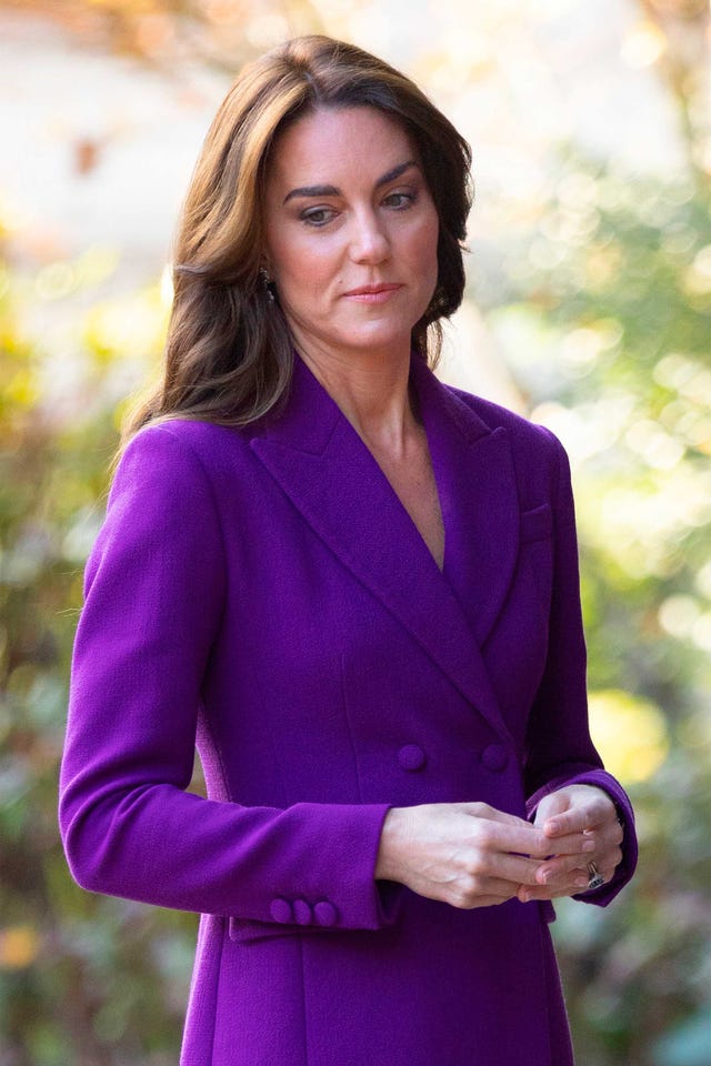 a woman in purple dress