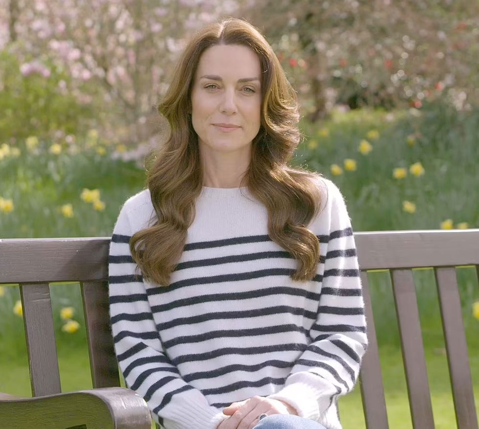a woman sitting on a bench