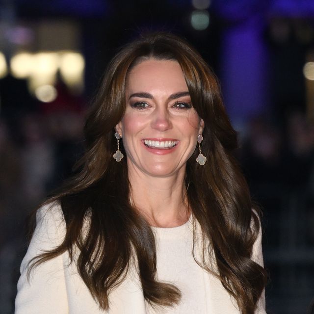 kate middleton smiles on her way into a carol concert