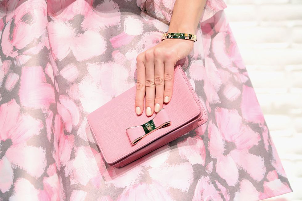 Pink, Handbag, Wallet, Fashion accessory, Bag, Material property, Peach, Hand, Finger, Nail, 