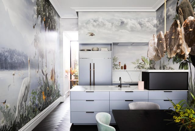 kitchen with tropical wall mural and pale blue minimalist cabinetry