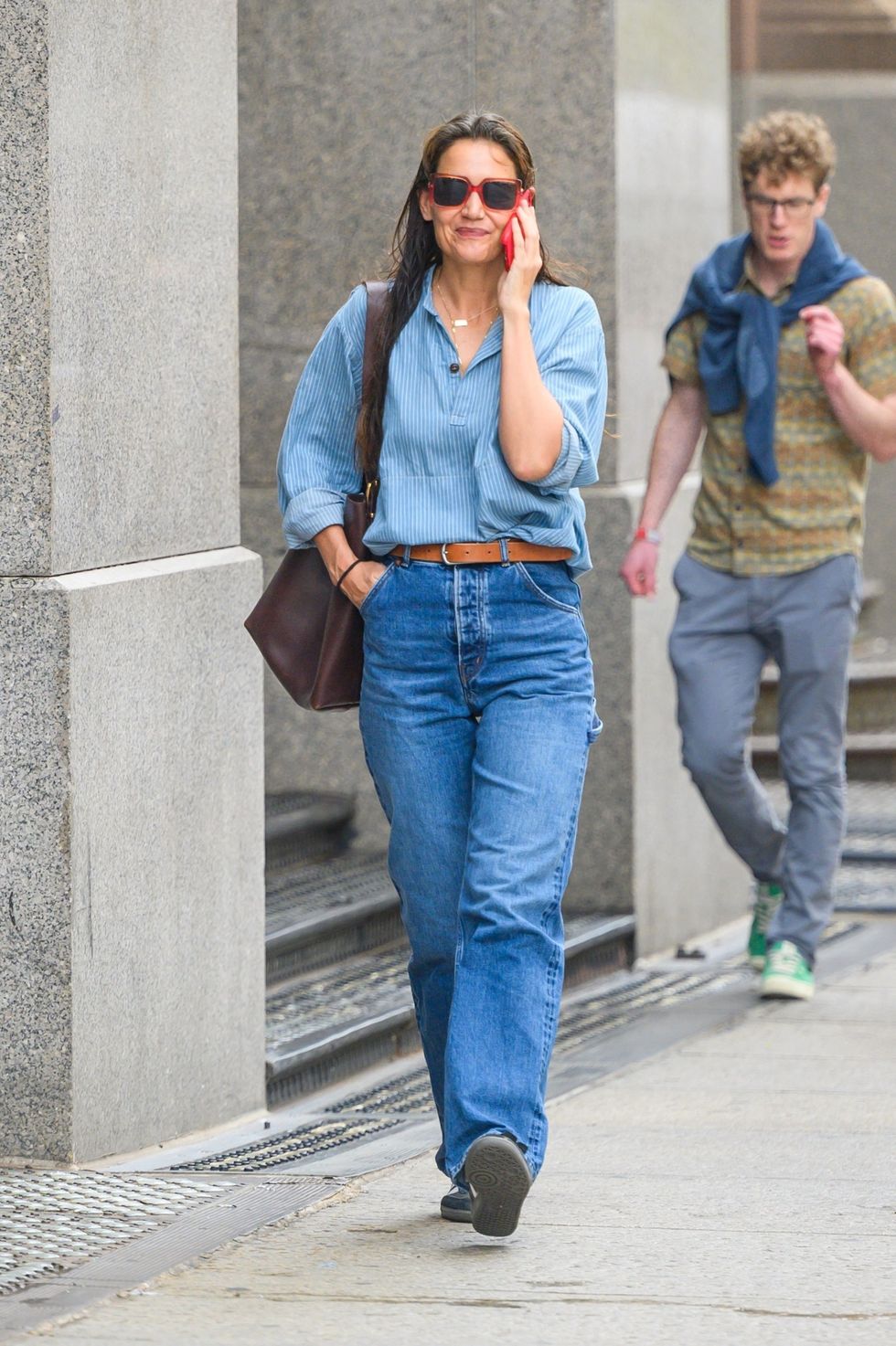 katie holmes wearing denim outfit and brown bag