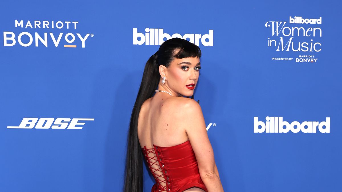 Katy Perry cheekily flashes bum and thong in lace-up corset skirt