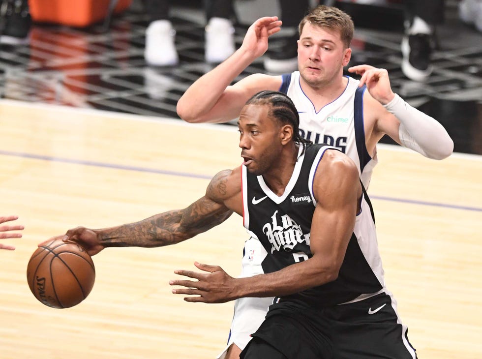 los angeles, ca may 22 kawhi leonard 2 of the la clippers passes against the dallas mavericks in the first half of game one of the western conference first round nba playoff basketball game at the staples center in los angeles on saturday, may 22, 2021