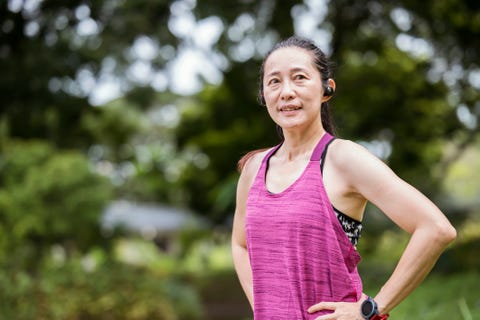 keep muscles strong and improves mental wealth in middle aged with routine workout profile view of a middle aged asian female take a rest to recovery during workout exercise in a public park outdoors