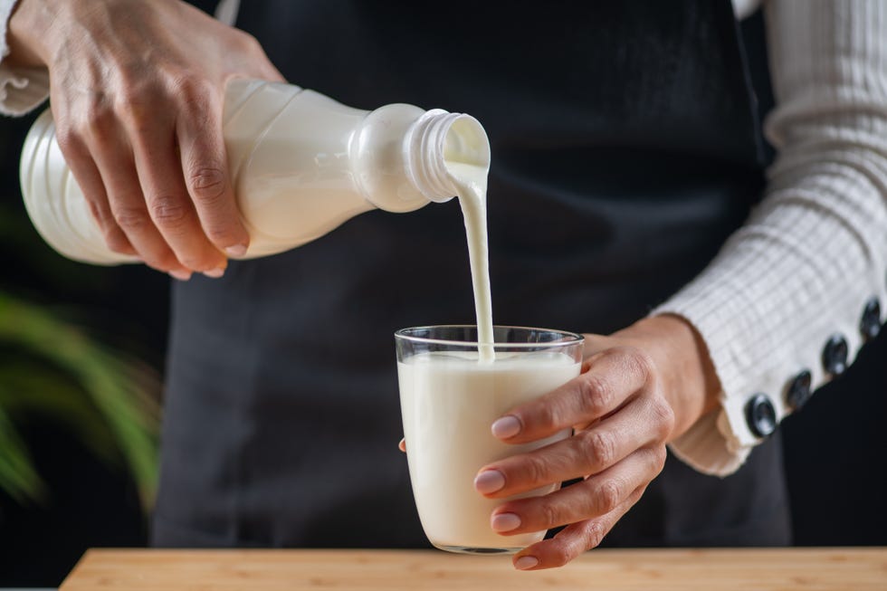 pouring kefir into a glass