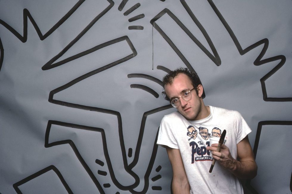 graffiti and visual artist keith haring photographed with one of his paintings in april 1984  photo by jack mitchellgetty images