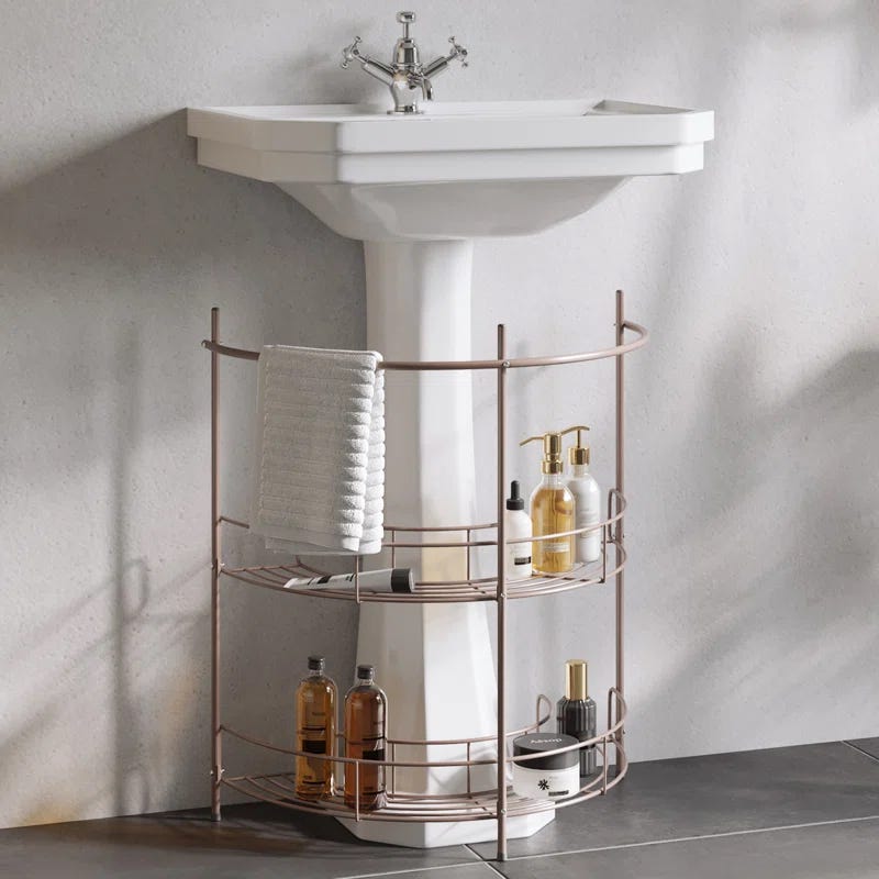 bathroom sink with a towel and toiletries storage beneath the basin