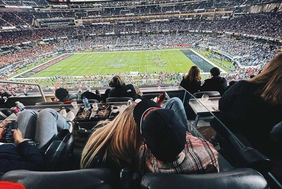 kelsea ballerini and chase stokes watching football game