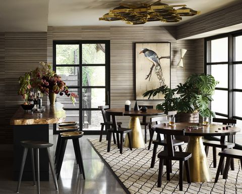 gleaming metallics lend 1940s glamour to the lounge and the tables and stools are crafted of cast and forged brass
