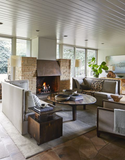 a stone and copper hearth warms a sitting room