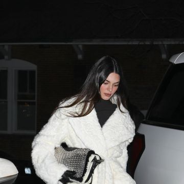 kendall jenner in a white coat and black outfit