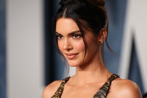 kendall jenner just wore a blue, sheer ball gown with feathers