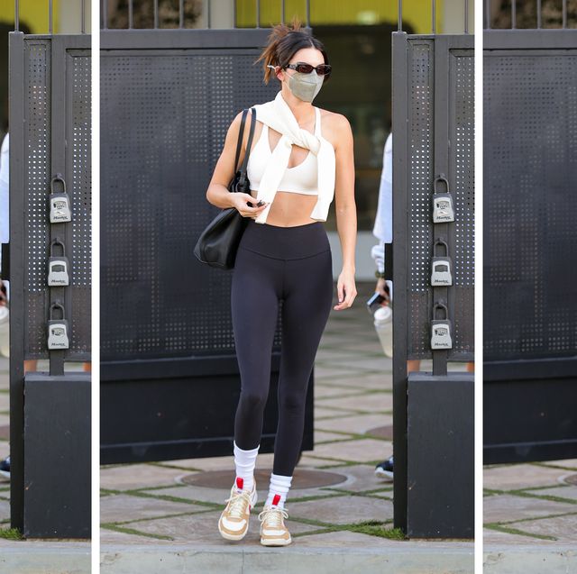 Kendall Jenner in black sports bra and leggings Alo Yoga