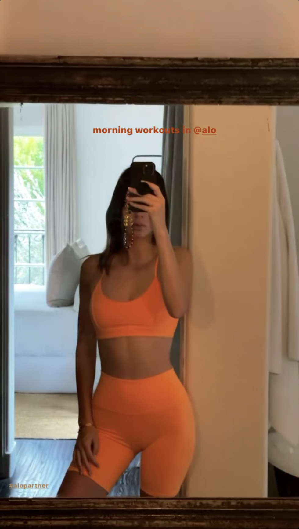 Shop Kendall Jenner's Neon Orange Alo Yoga Sports Bra And Bike Shorts