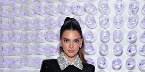 Kendall Jenner wears a tiny sports bra and leggings for dog walk