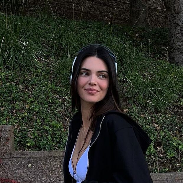 Kendall Jenner wears a tiny sports bra and leggings for dog walk