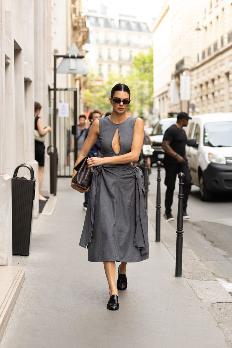 Kendall Jenner in black corset and grey wide leg trousers in Paris on  October 2