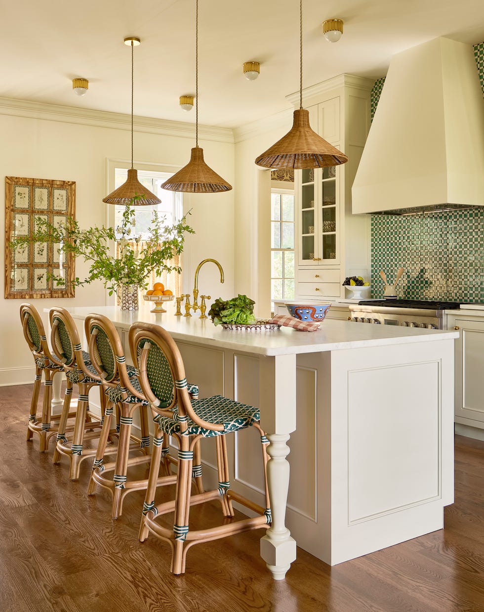 kitchen with white cabinetry and island with bar stools