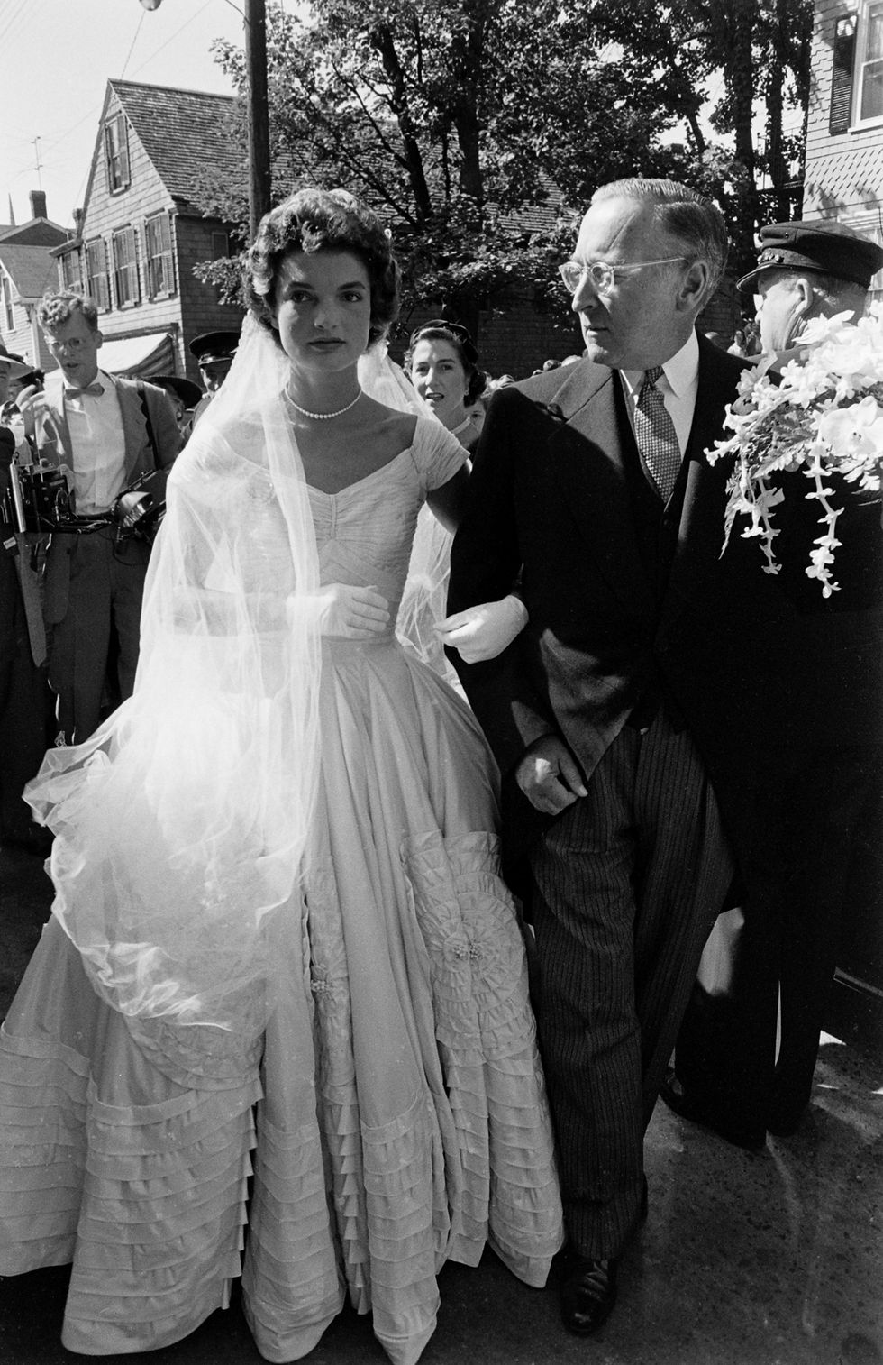 Jacqueline Kennedy is escorted to St Mary's Church by her stepfather, Hugh D Auchincloss for her wedding to John F Kennedy.