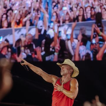 kenny chesney performing on stage at here and now 2022 tour