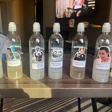 plastic water bottles labeled for various aid stations at a race event plastic water bottles labeled for various aid stations at a race event