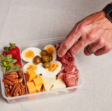 does keto work a hand reaching into a container of keto snacks