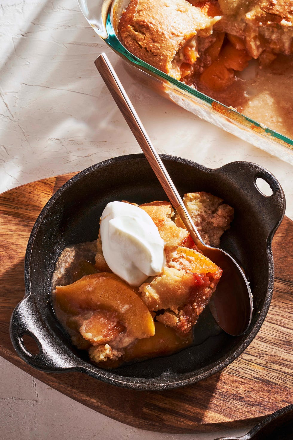 gluten free peach cobbler in a small cast iron pot