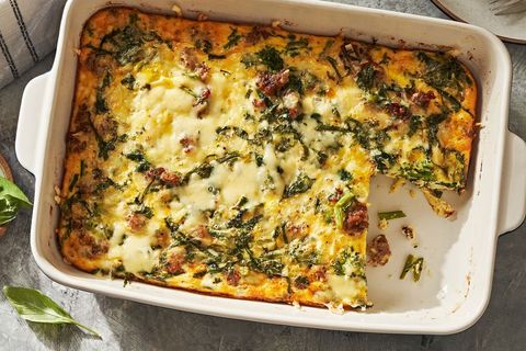 eggy keto breakfast casserole in a baking dish with one square slice missing