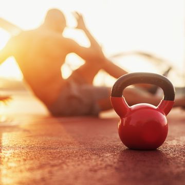 kettle bell in focus, fitness training at early morning
