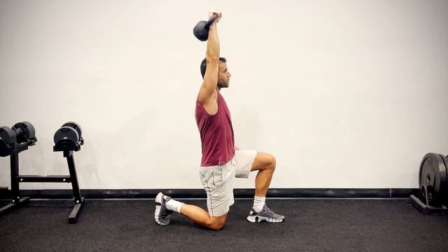 upper body kettlebell workout, half kneeling overhead press